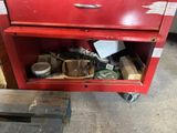 a red tool cabinet with a lot of tools in it