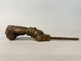 an old wooden baseball bat with a wooden handle on a white surface