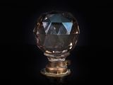 an image of a crystal knob on a black surface