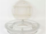 a clear plastic container with a lid on a white surface