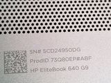 a close up of a metal plate with a qr code on it