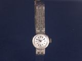 an image of a wrist watch on display in a glass case