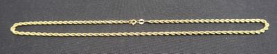 a close up of a chain on a black surface