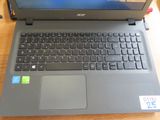 a laptop that is sitting on a table with a sticker on it