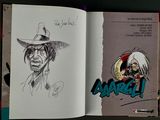 a book with a drawing of a man in a hat and a drawing of a man in a cowboy hat