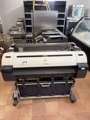 a large printer that is sitting in a room