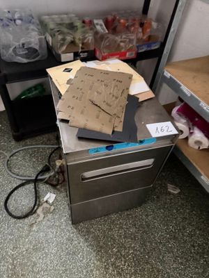 a pile of papers sitting on top of a metal counter