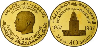 a close up of a gold coin with a picture of a man on it
