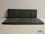 a black keyboard and a mouse on a table