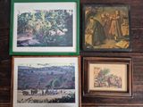 four framed pictures of people and animals on a wooden wall