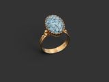 a gold ring with a turquoise stone in the center