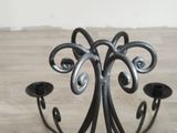 a candle holder that has two candles on it