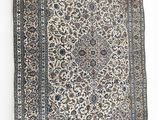 an antique persian rug with a floral design on a white background