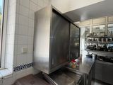 a kitchen with a large stainless steel refrigerator in it