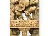 statue of lord ganesha on a wooden stand