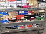 a metal cart with many boxes on top of it
