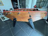a foosball table in the middle of a living room