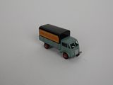 a toy truck that is sitting on a white surface