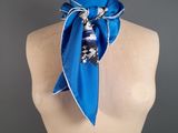the blue scarf is tied to the neck of a mannequin mannequin
