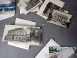many old postcards on the table with pictures on them