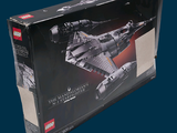 a box with a model of a space ship in it