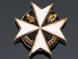 an image of a white and gold cross with a crown on it