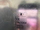 a close up of a cell phone on a metal surface