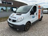 a white van that is parked in front of a building