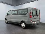 a silver van that is parked inside of a building