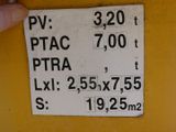 a sign on the side of a yellow wall that says ptac ptra