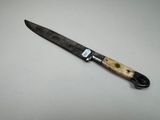 a knife that is sitting on a table