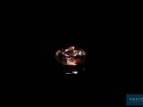an oval shaped diamond with a dark background