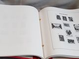 an open book with pictures on it on a bed