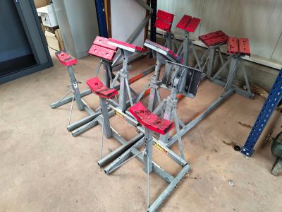 many red stools sitting on the floor in a room