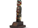 an image of a wooden statue of a person on a white background