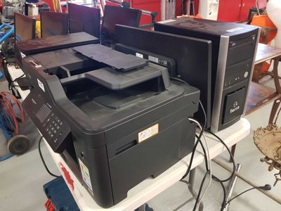 many different types of printers sitting on a table