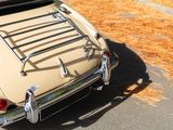 a beige car parked on the side of the road