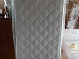a mattress that is sitting in the middle of a room