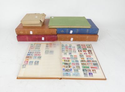 three books are stacked on top of each other on a white surface