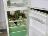 an open refrigerator with a lot of food inside of it