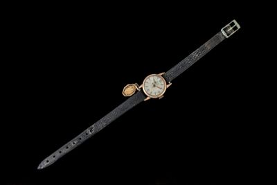 an image of a wrist watch on a black background