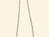 a white beaded necklace on a white background