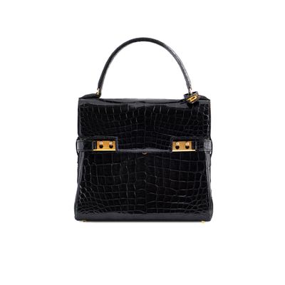 a black crocodile skin handbag with gold hardware