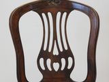a wooden chair with a yellow upholstered seat