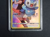 an image of a pokemon card with a girl and a boy