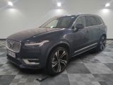 a grey volvo suv parked on a checkered floor in a garage