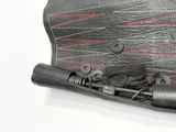 a black purse with a red and white design on the inside of it