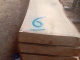a large piece of wood that is sitting on the ground
