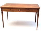 a small wooden table with two drawers on it