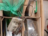 a cardboard box filled with assorted items in a kitchen